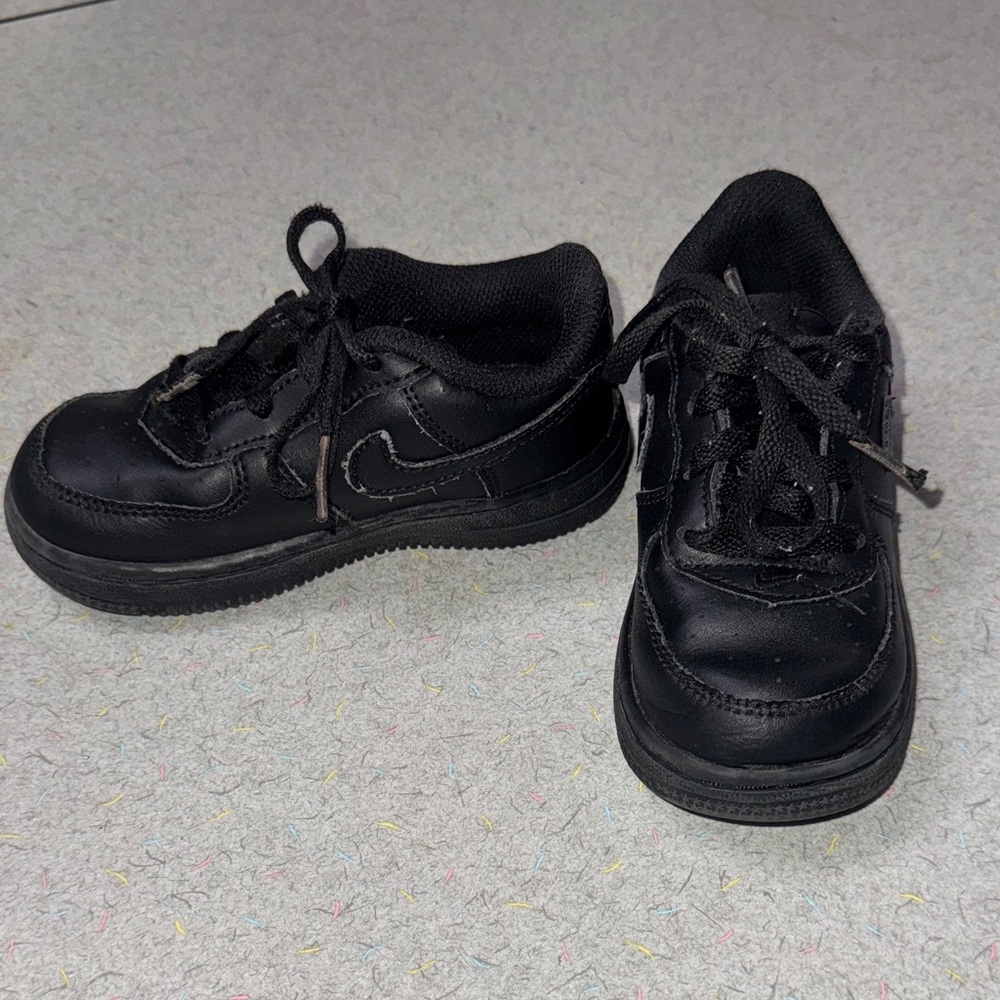 Kids black Nike Air Force 1s